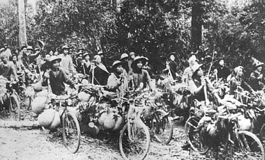 Civilian supply workers using pack bicycles to transport goods to the front