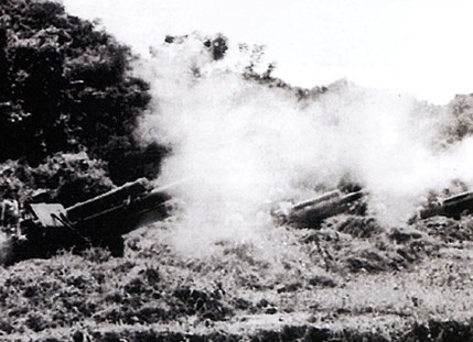 Artillery pieces firing on enemy positions